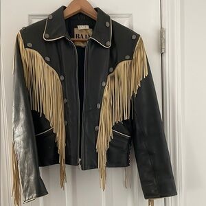 Beautiful heavy leather with quilt lining and beautiful fringe. High quality.